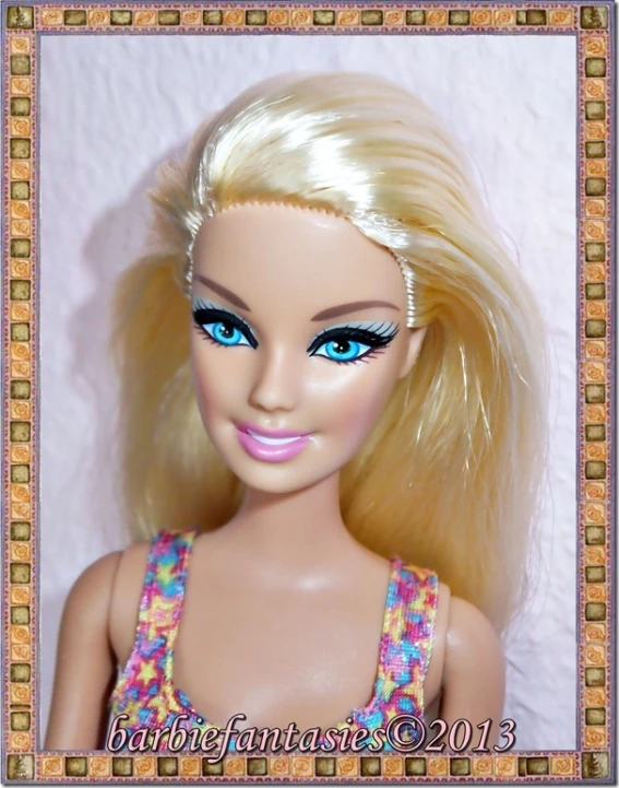 a doll with blonde hair and blue eyes is shown