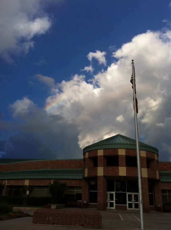 a building with a rainbow in the sky