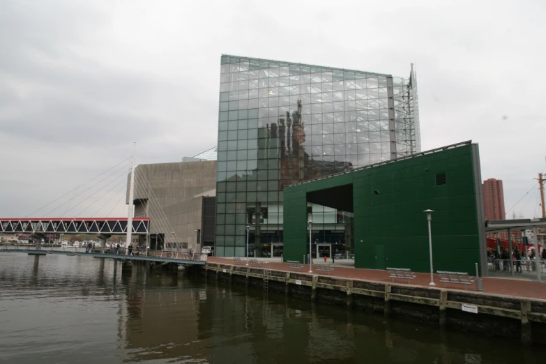 a city near the water has people and buildings