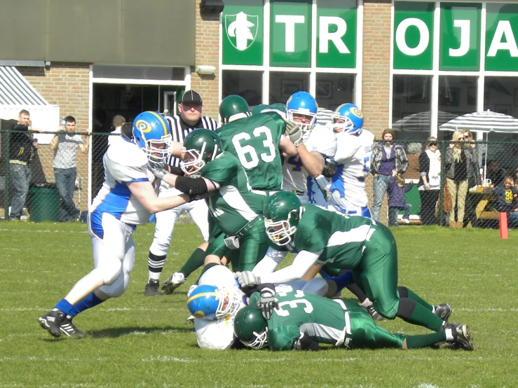 a football team is running towards the goal