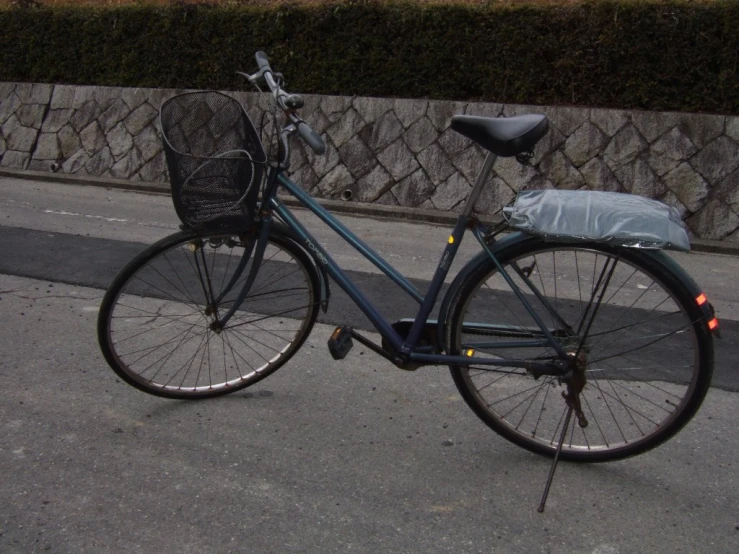 a bicycle with a basket on a city street