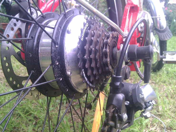 a close up of a bicycle wheels and gears