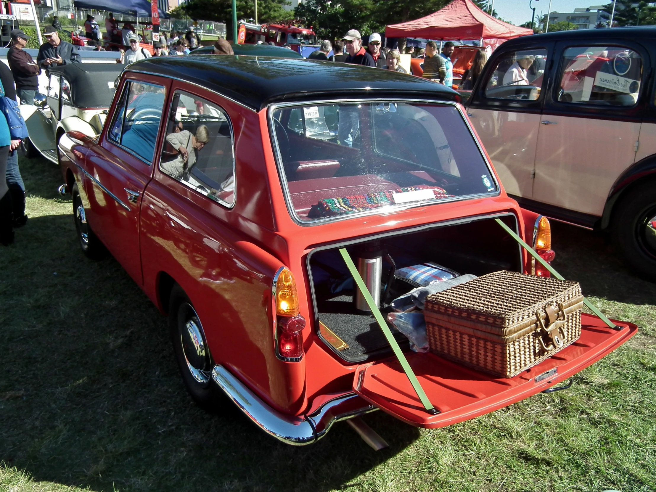 a close up of an old red car on display