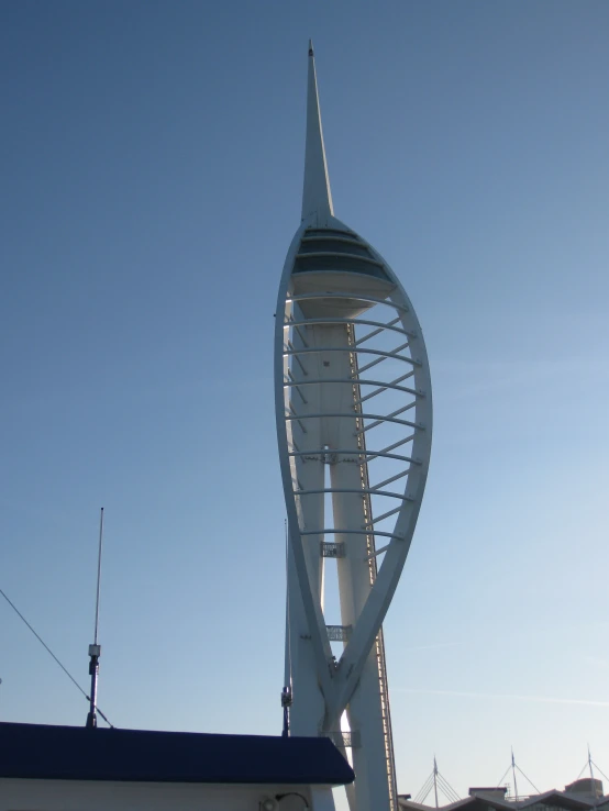 a close up of a building with a curved tower