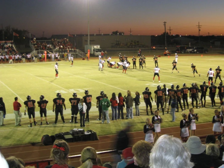 the stadium during a football game with fans watching