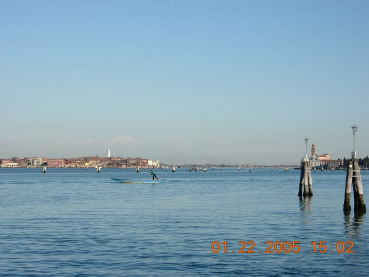 a view of a body of water and dock with boats in it