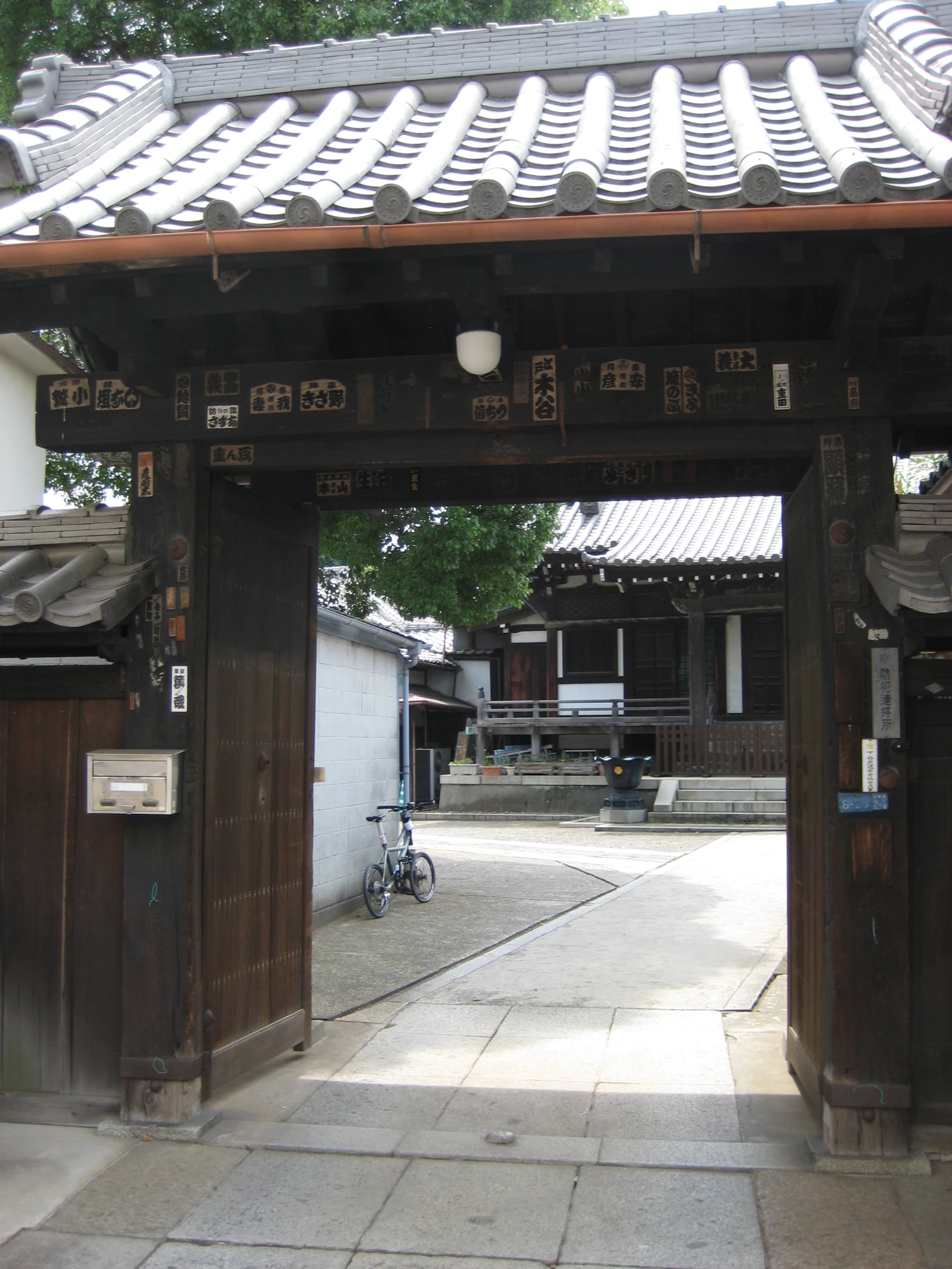 a picture of a gate and some bikes outside