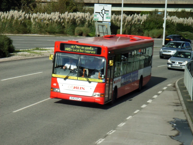 a bus making it's way down a roadway