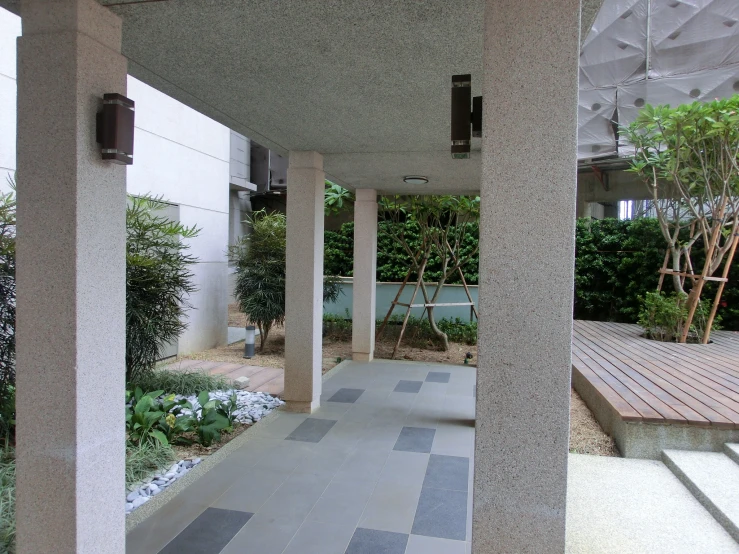 this image is a outdoor area that has pillars and patios