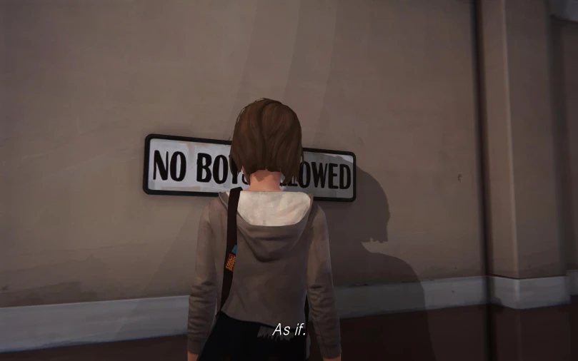 a woman that is holding a bag under a sign