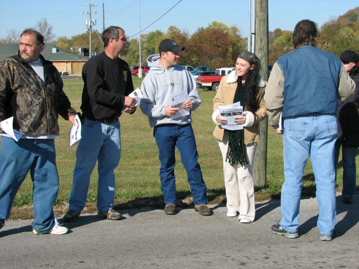 a group of men standing next to each other