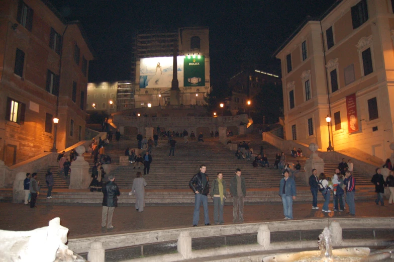 many people stand in front of some stairs