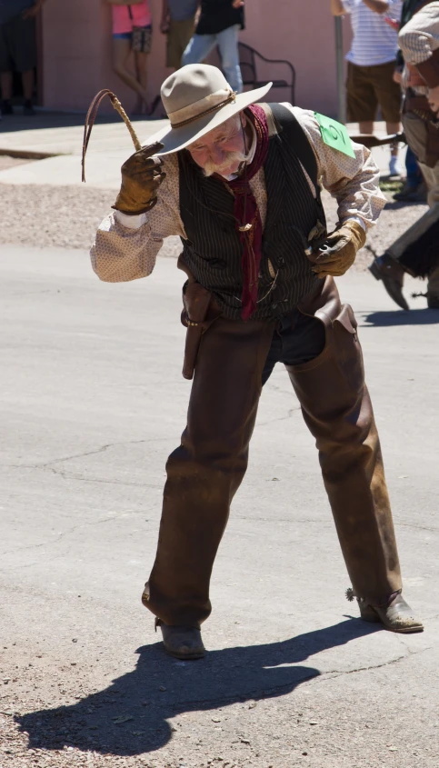 a woman with a cowboy hat in an intersection