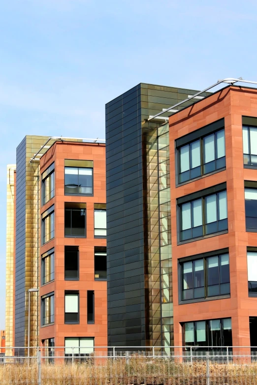 two tall brick buildings next to each other