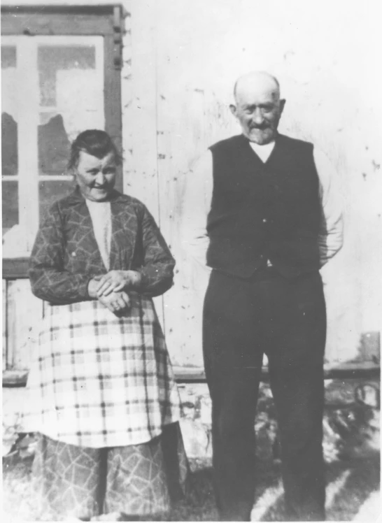 an old po of a man and woman posing for the camera