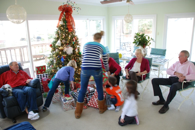 a family gathering by the fireplace for christmas