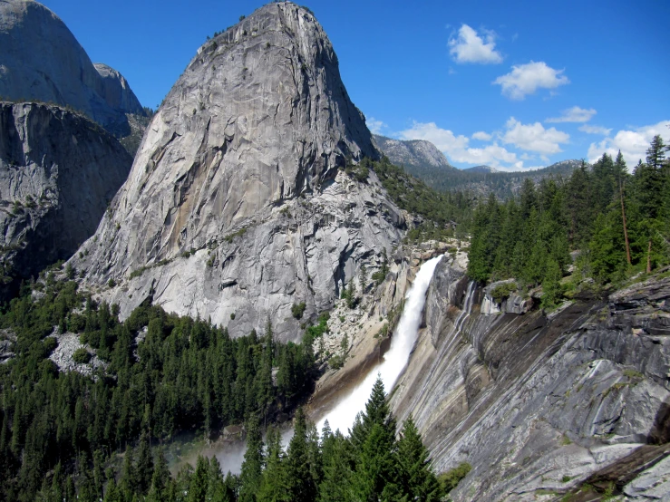 a large body of water sitting next to the top of mountains