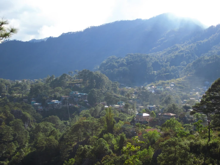 a small town nestled in the trees in the mountains