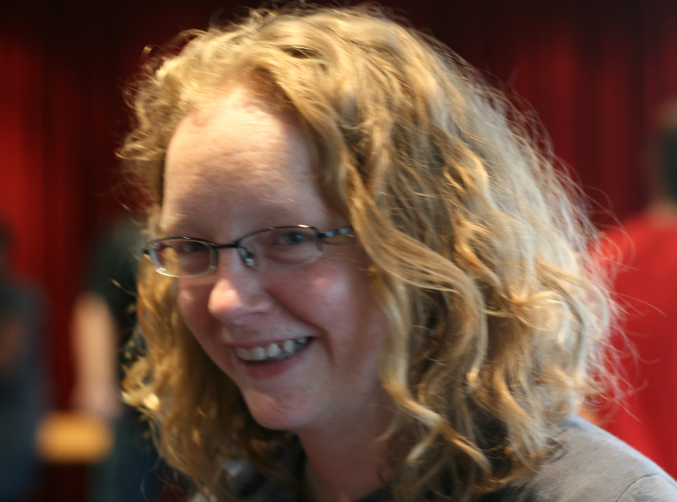 a close up view of a woman with glasses