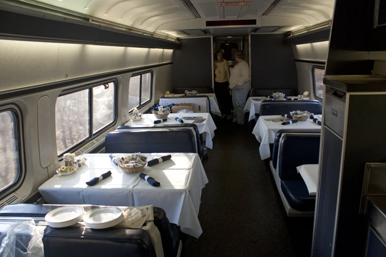 several tables laid out for a party on a train