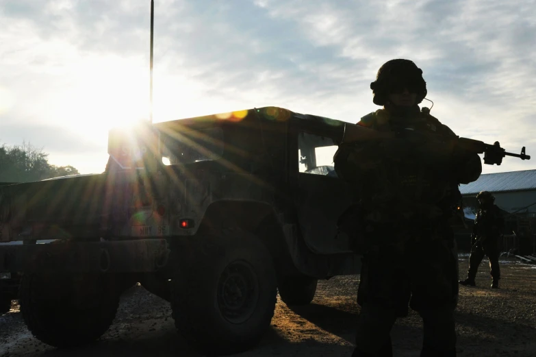 a soldier is standing outside with his rifle