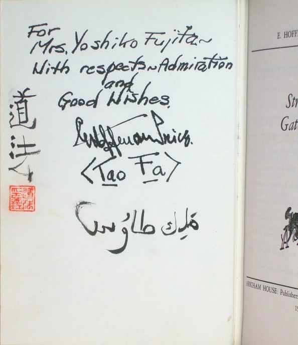 a close up of a book with writing