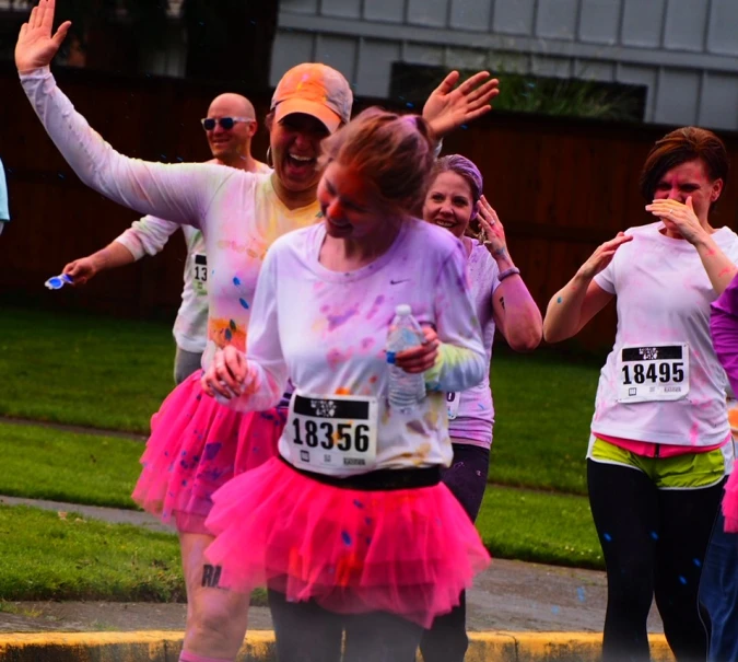 some people are celeting at a run wearing tutus and tutus