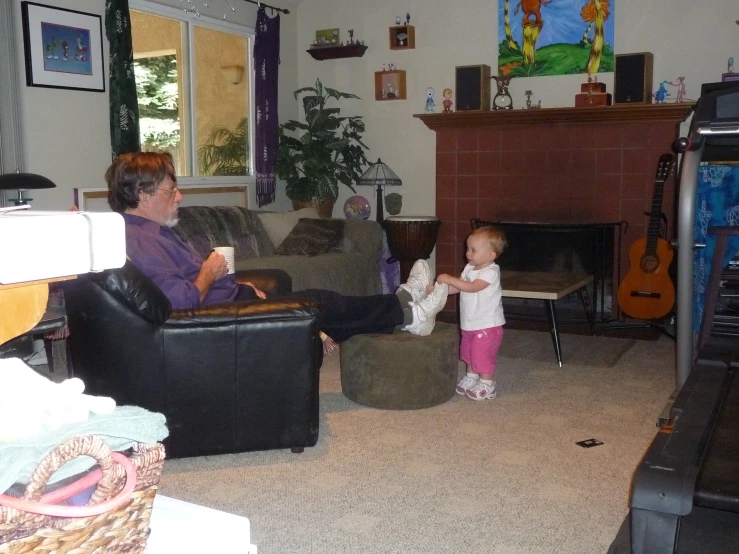 small toddler playing with her mom in the living room