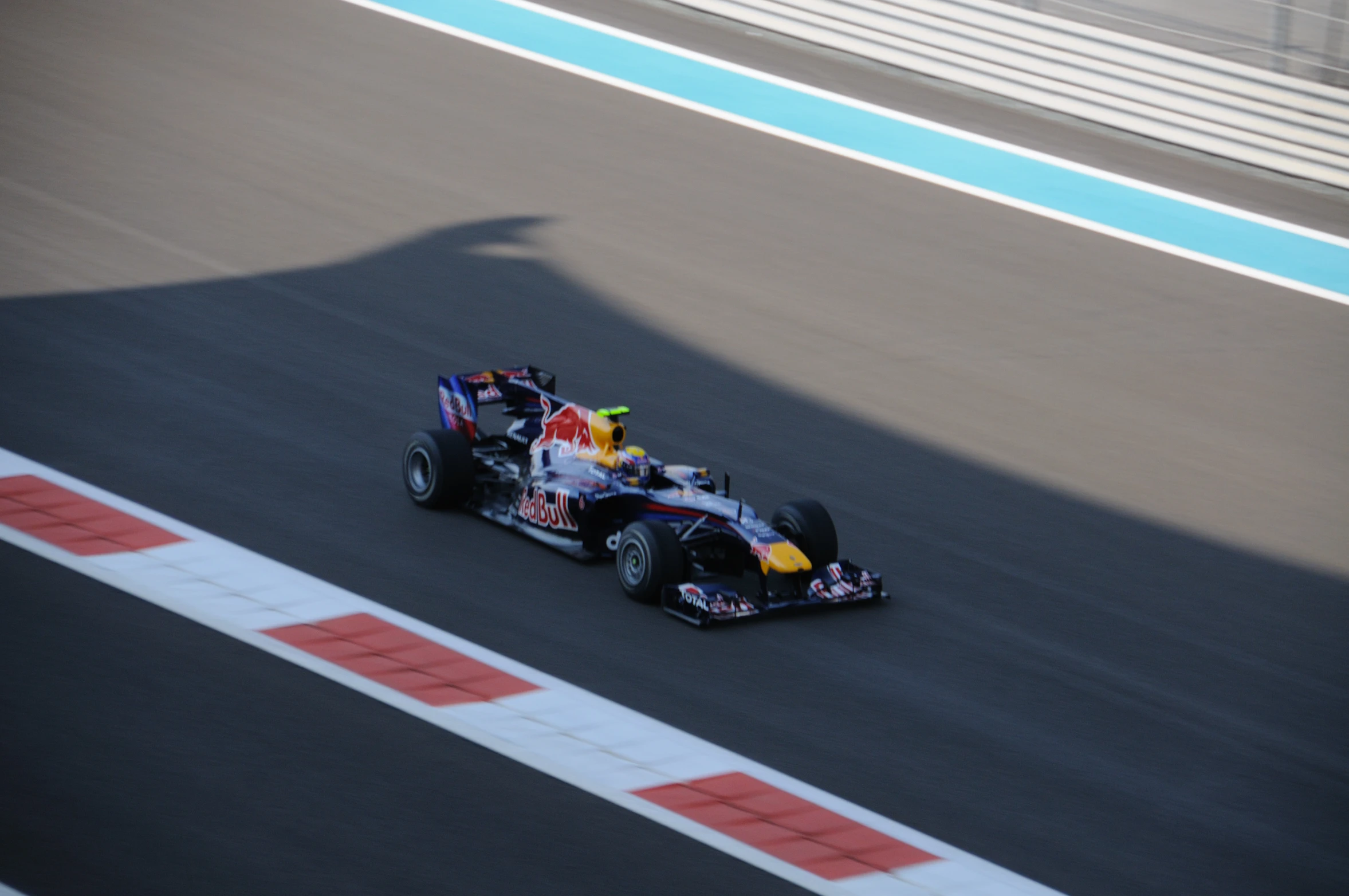 the red bull formula car speeds around the track