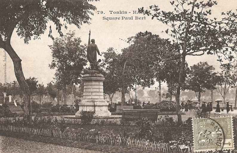 an old po of a monument surrounded by trees