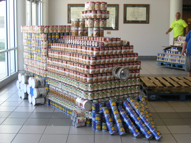 stacks of canned soda cans stacked on pallets