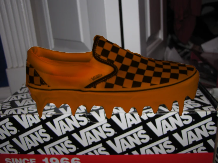 a box with a vans skateboard cake with icing on it