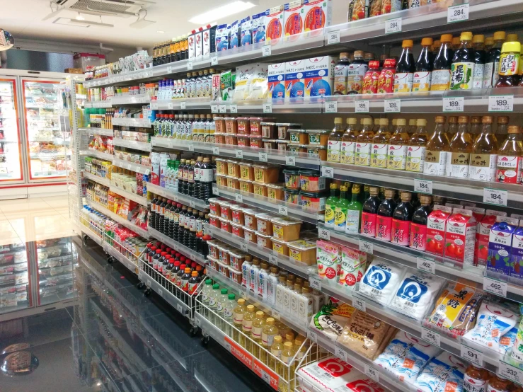 the shelf in the market is filled with lots of different products