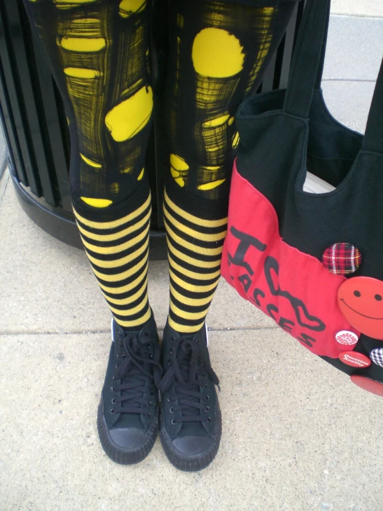 a close up of a person wearing some colorful socks