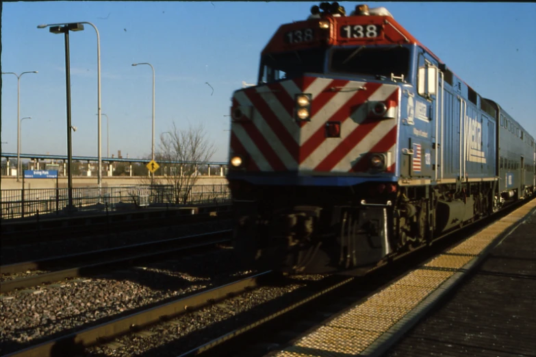 a train that is traveling down tracks by itself