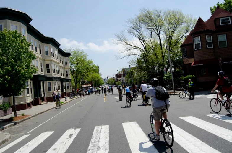 the many bikers are driving down the road together