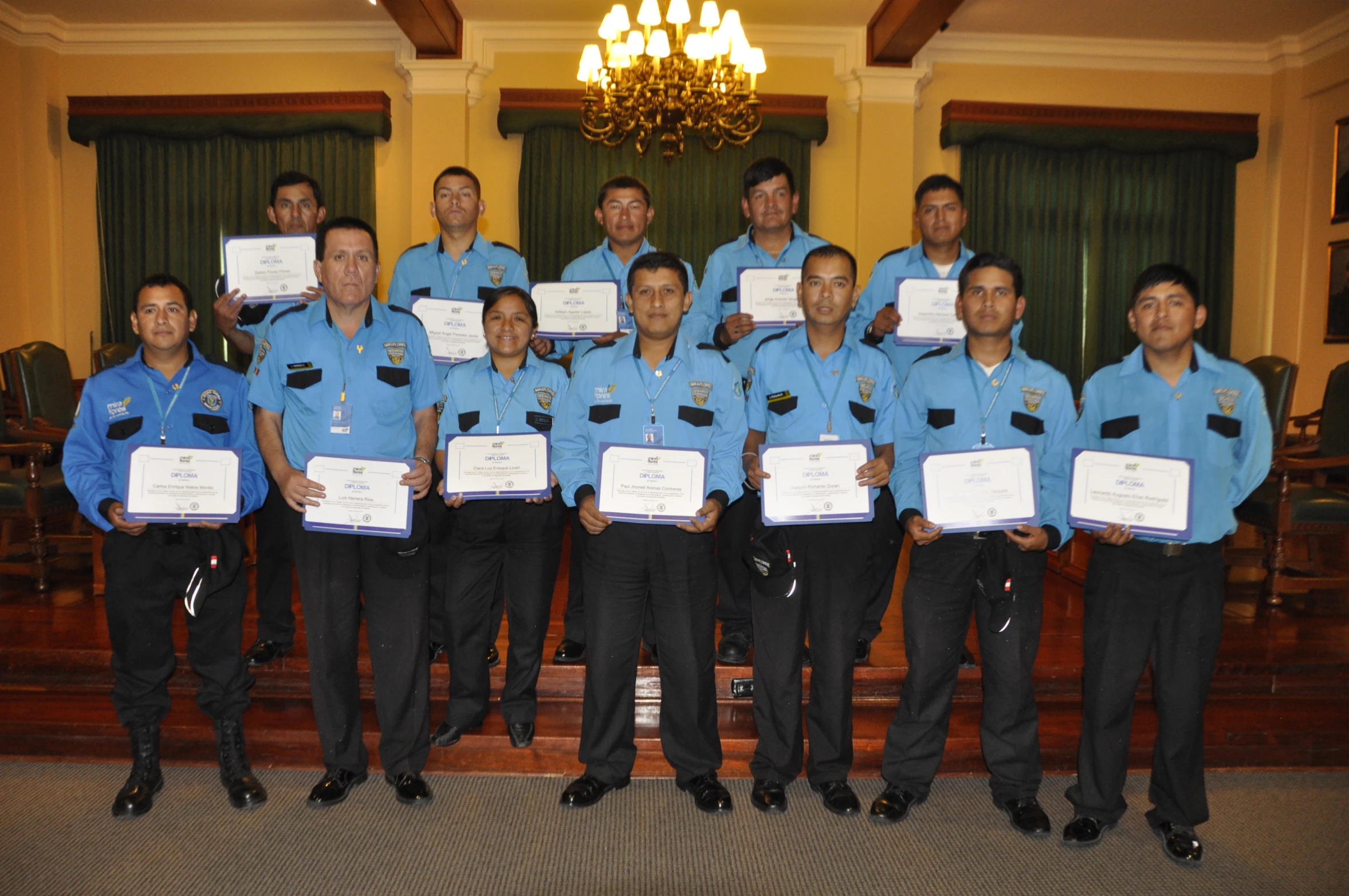 a group of men who are holding up awards