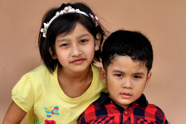 two little s one is wearing a flowery headband