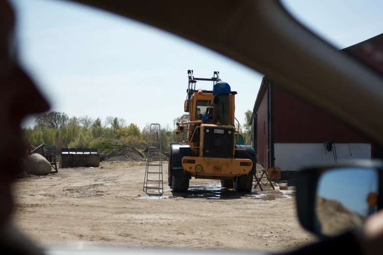 a small tractor with the mirror on it