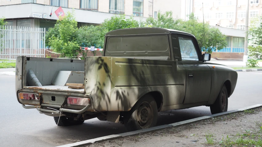 a military truck on the street with no wheels