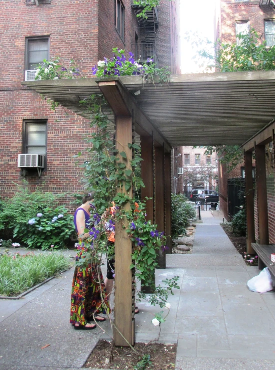 a wooden deck surrounded by a series of hanging planters