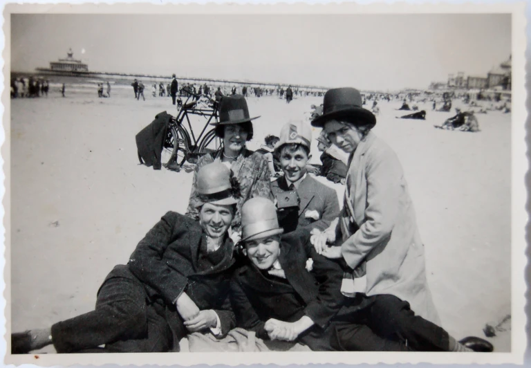 an old black and white po of people on the beach