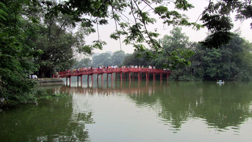 the red bridge crosses over the water