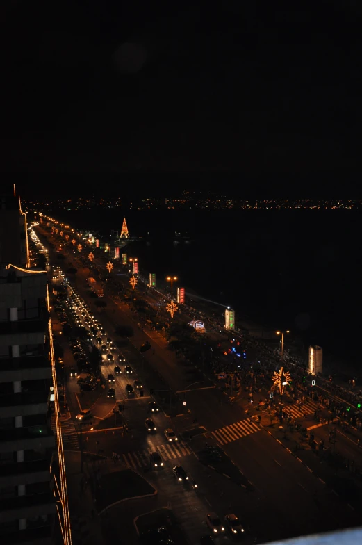 an aerial view of a highway at night with many traffic and lights