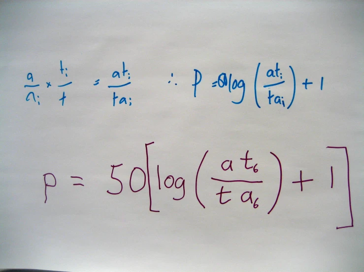 a white board covered with calculations and some writing