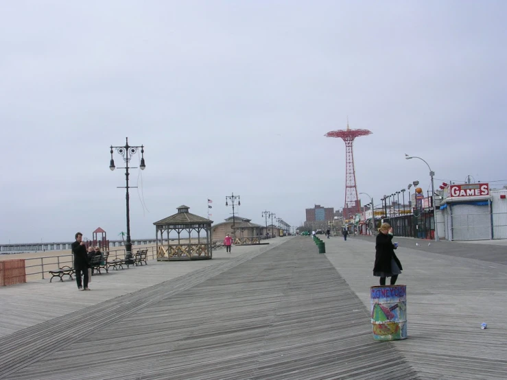 boardwalk with people walking on pier during daytime