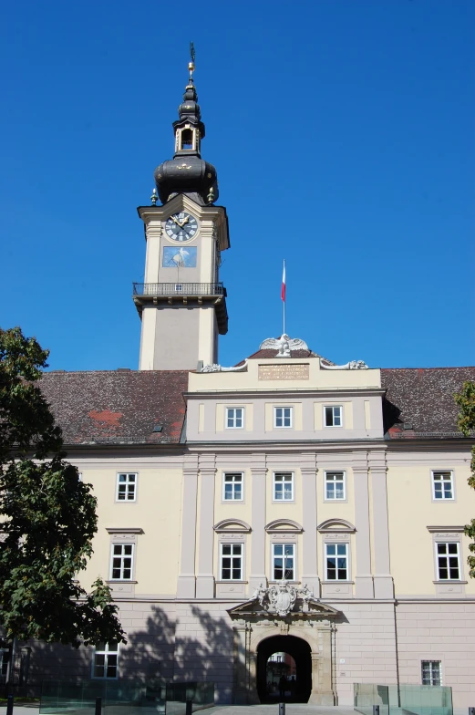 an old building with a clock tower in the background