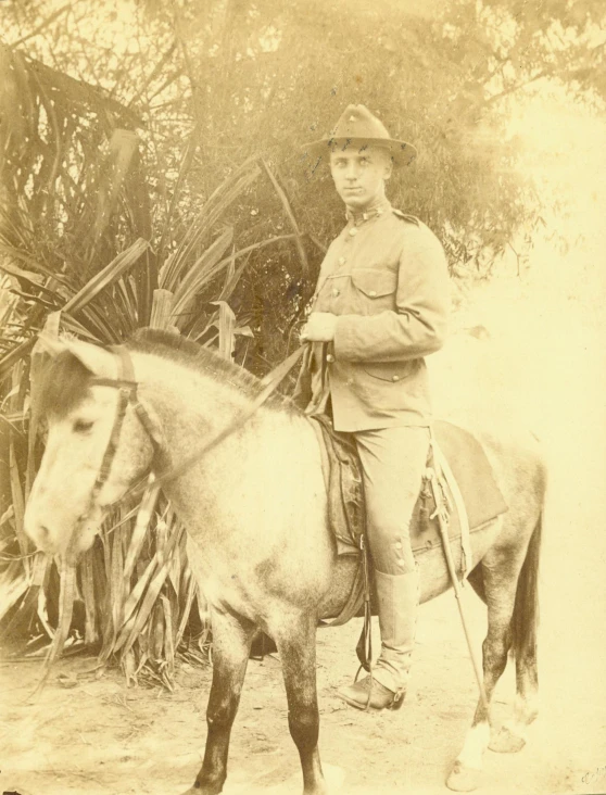 an old po of a man on top of a horse