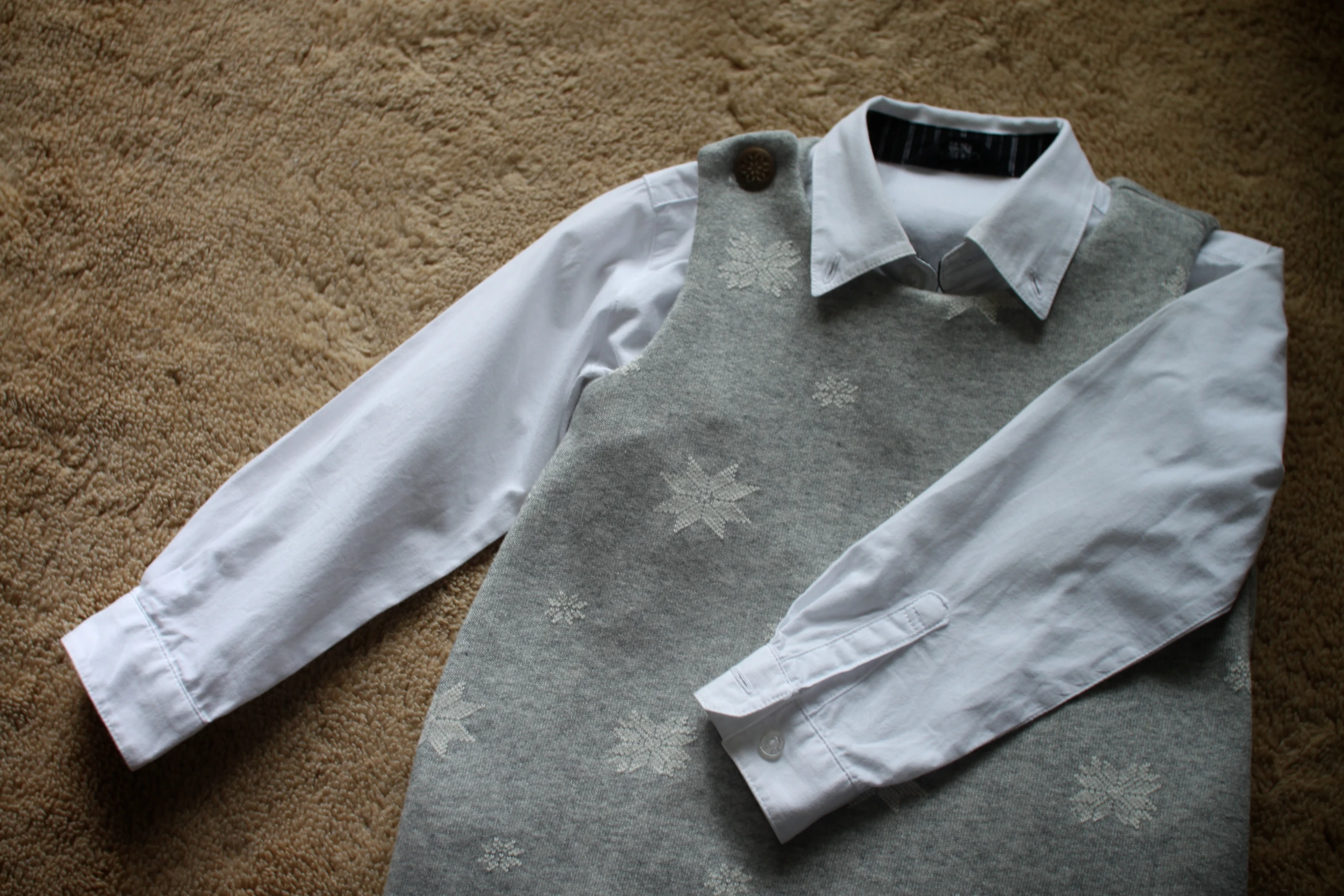 this is a close up view of a dress shirt and vest