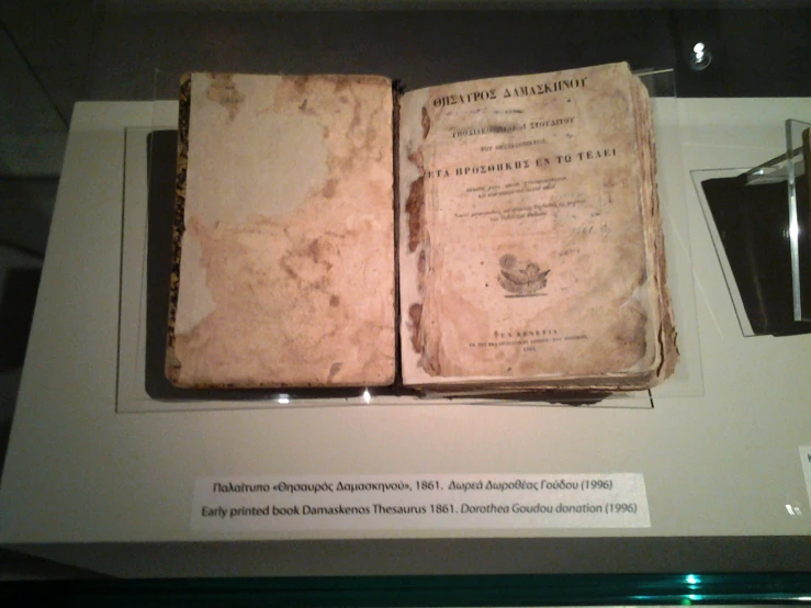 a close up of an old book on display